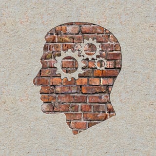 Psychological Concept - Profile of Head with Cogwheel Gear Mechanism on the Brick and Plastered Wall..jpeg